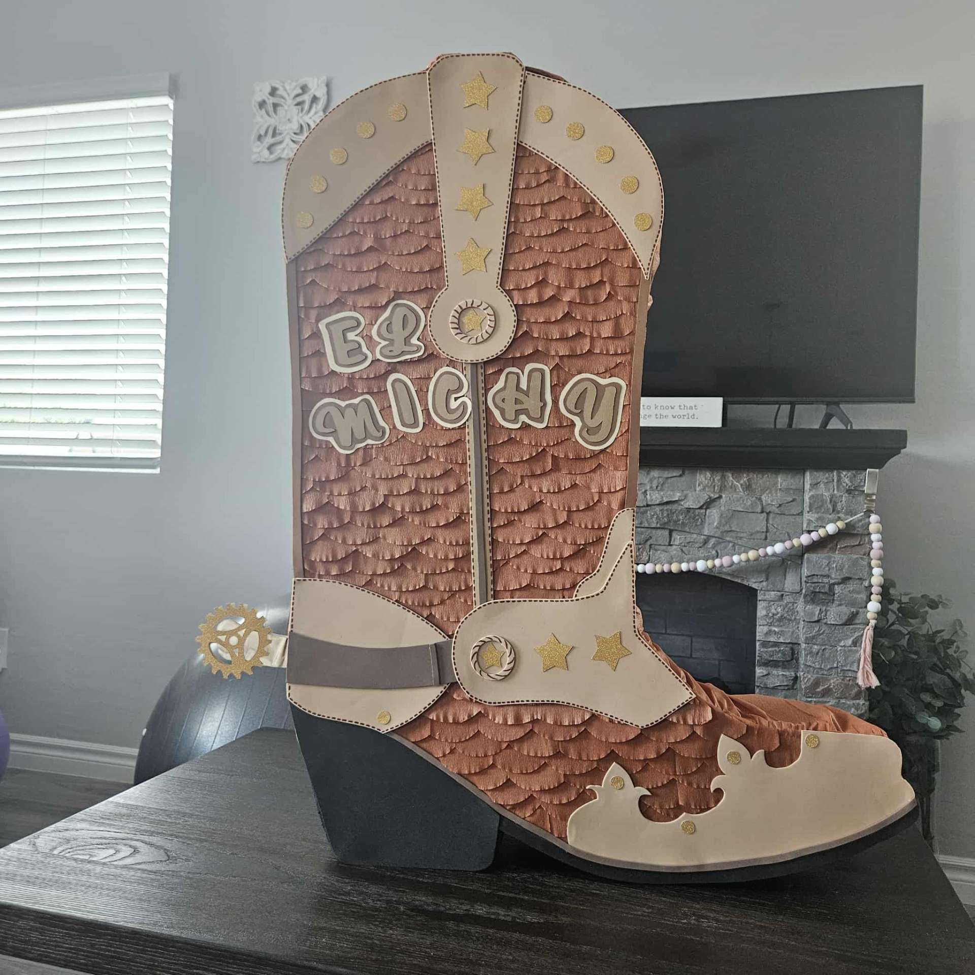 Cowboy boot piñata with the name El Michy
